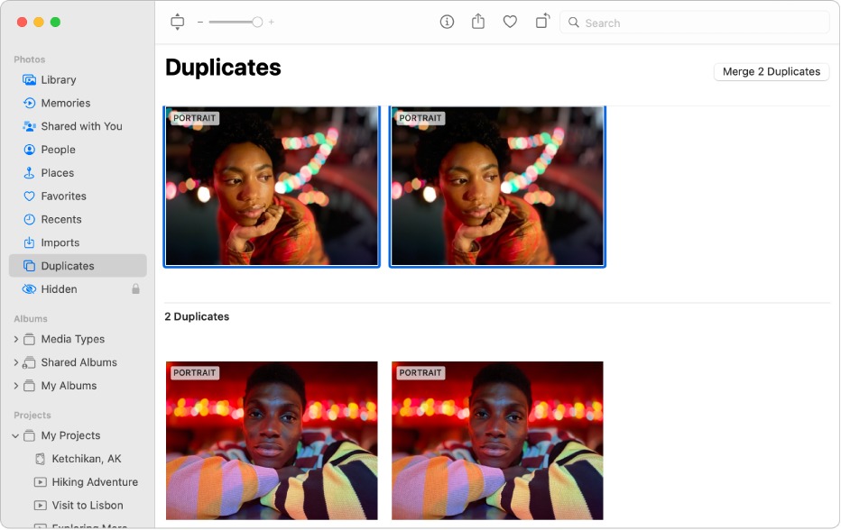 the Duplicates album in Photos displaying duplicate photos found on Mac
